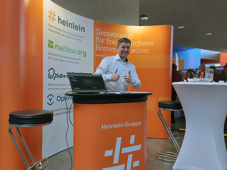 Heinlein Gruppe mit Stand zu mailbox.org, OpenTalk, OpenCloud und Heinlein Support bei den Chemnitzer Linuxtagen 2025